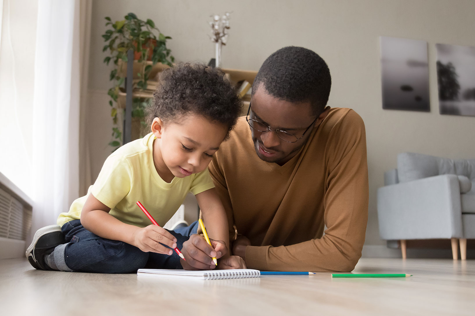 Parents Practicing Writing With Their Child